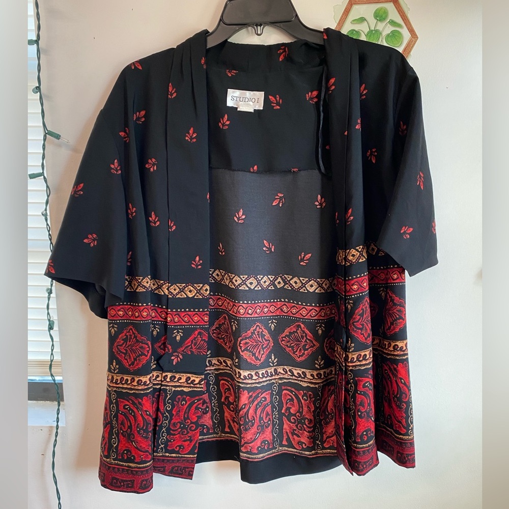 Flowy black, red, and brown blouse.